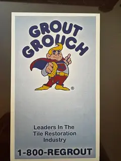 Photograph of a printed Grout Grouch branded sticker